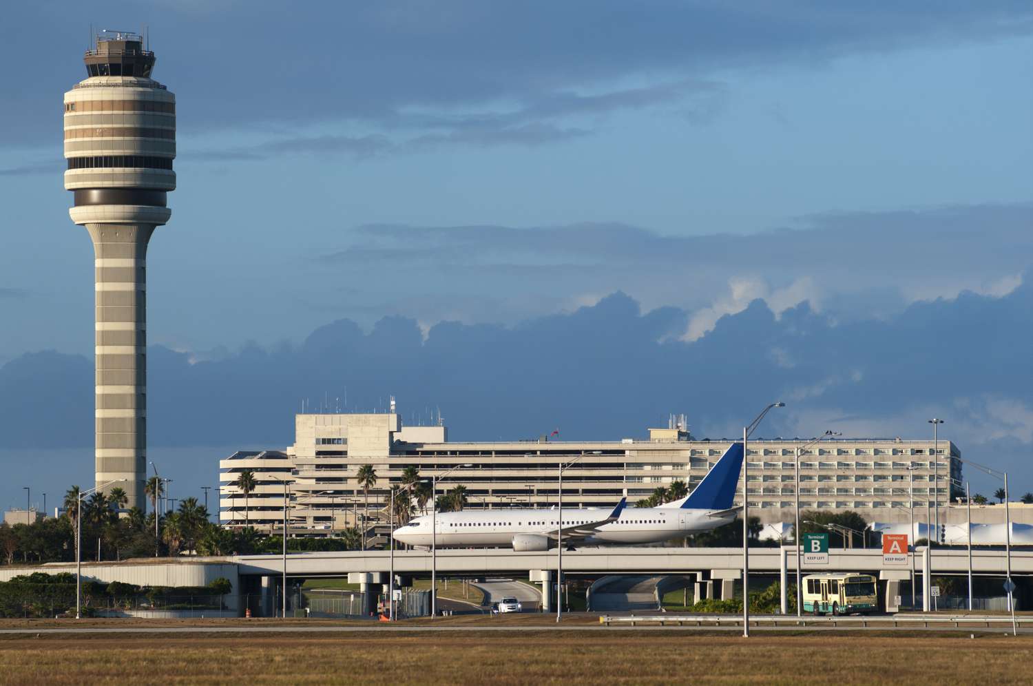 Private car service chauffeur meeting travelers at Orlando International Airport (MCO)